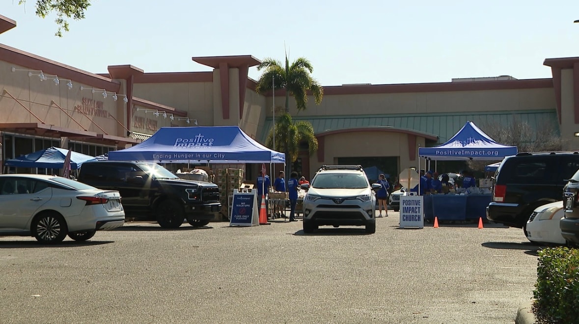 Positive Impact tents set up for a drive-through food distribution event